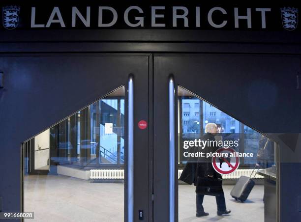 The former owner of the chain of chemist shops Schlecker, Anton Schlecker, walks through the lobby at the regional court in Stuttgart, Germany, 20...