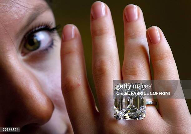 Model displays an extremely rare emerald-cut D colour, flawless, Type II A diamond ring weighing 52.82 carats during a Sotheby's auction preview on...