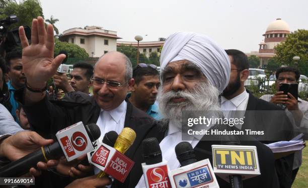 Additional solicitor general, Maninder Singh addresses media personnel in the presence of Bharatiya Janata Party's spokesperson Nalin Kohli and other...