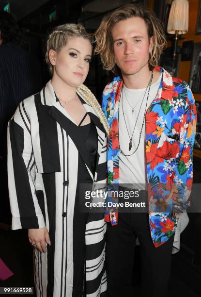 Kelly Osbourne and Dougie Poynter attend the Gay Times dinner hosted by Kyle De'Volle at The Ivy Market Grill on July 4, 2018 in London, United...