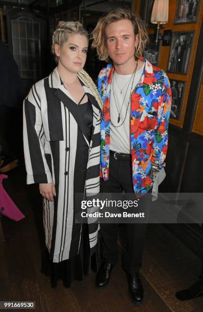 Kelly Osbourne and Dougie Poynter attend the Gay Times dinner hosted by Kyle De'Volle at The Ivy Market Grill on July 4, 2018 in London, United...