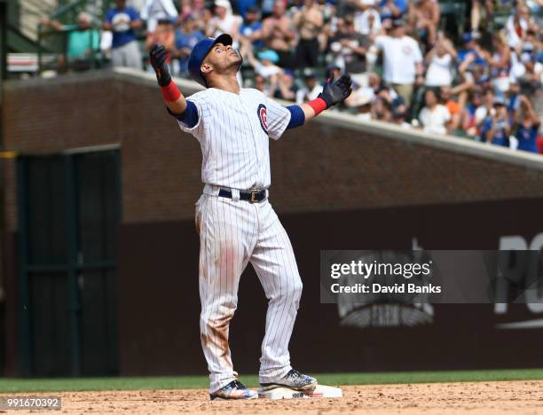 Willson Contreras of the Chicago Cubs reacts after hitting a two-RBI double against the Detroit Tigers during the seventh inning on July 4, 2018 at...