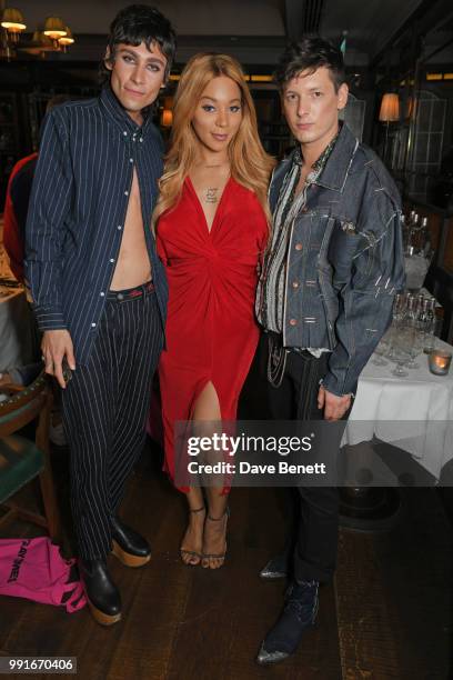 Kyle De'Volle, Munroe Bergdorf and Damon Baker attend the Gay Times dinner hosted by Kyle De'Volle at The Ivy Market Grill on July 4, 2018 in London,...