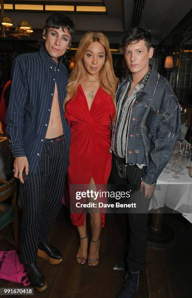 Kyle De'Volle, Munroe Bergdorf and Damon Baker attend the Gay Times dinner hosted by Kyle De'Volle at The Ivy Market Grill on July 4, 2018 in London,...