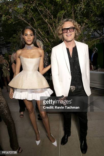 Cindy Bruna and Peter Dundas attend the amfAR Paris Dinner at The Peninsula Hotel on July 4, 2018 in Paris, France.