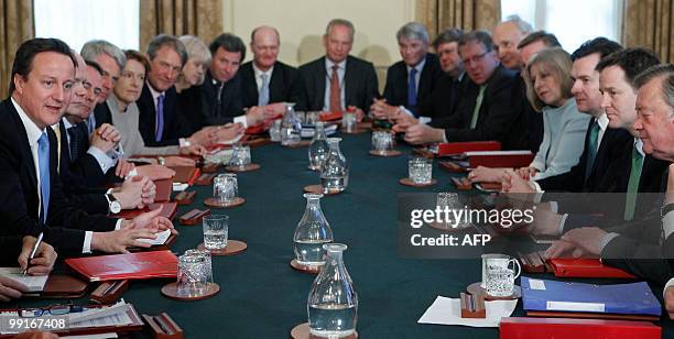 Britain's new Conserative Party Prime Minister, David Cameron , and Liberal Democrat Deputy Prime Minster, Nick Clegg , attend the first Cabinet...