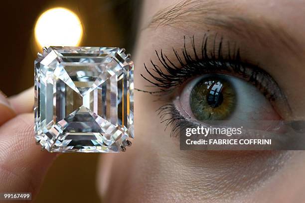 Model displays an extremely rare emerald-cut D colour, flawless, Type II A diamond ring weighing 52.82 carats during a Sotheby's auction preview on...