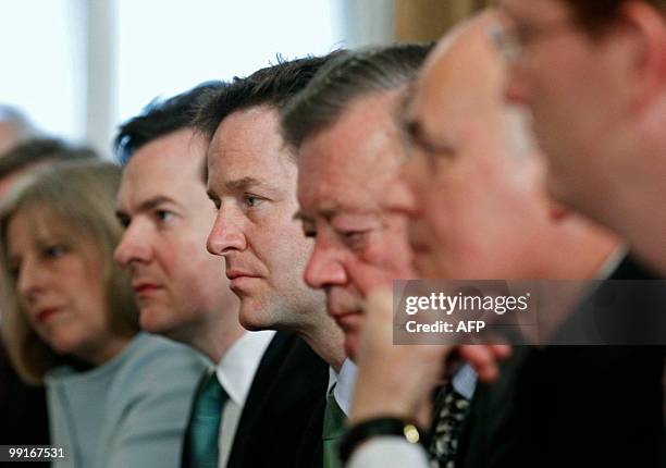 Britain's new Liberal Democrat Deputy Prime Minister, Nick Clegg , listens as he attends the first Cabinet meeting of the new Conservative/Liberal...