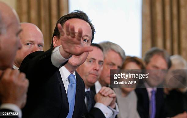 Britain's new Conserative Party Prime Minister, David Cameron , and Liberal Democrat Deputy Prime Minster, Nick Clegg , attend the first Cabinet...