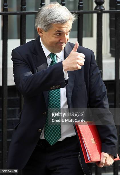 Energy and Climate Change Secretary, Chris Huhne, arrives for the first cabinet meeting of the new coalition government at Downing Street on May 13,...