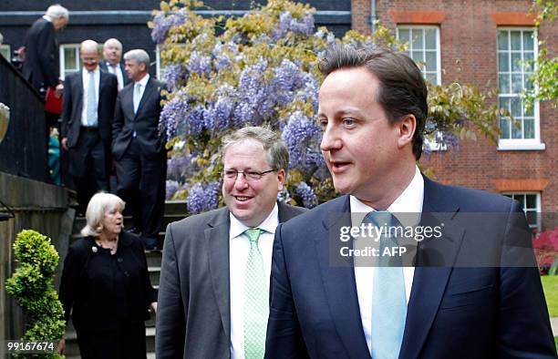 Britain's new Conserative Party Prime Minister, David Cameron , leads his new Conservative/Liberal Democrat coalition Cabinet for a group photograph...