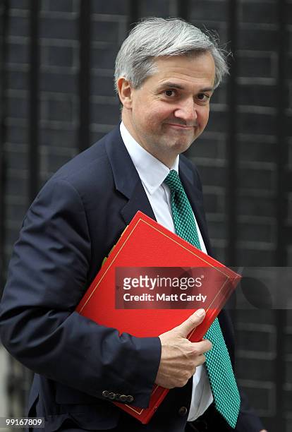 Energy and Climate Change Secretary Chris Huhne leaves Downing Street following the first cabinet meeting of the new coalition government at Downing...