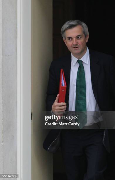 Energy and Climate Change Secretary Chris Huhne leaves Downing Street following the first cabinet meeting of the new coalition government at Downing...