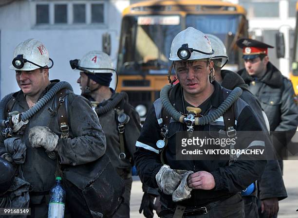 Russian miners walk from the Raspadskaya coal mine, in Mezhdurechensk on May 13, 2010 after making a rescue attempt. The death toll following twin...