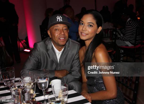 Russell Simmons and model Heidi Allende attend the 2010 SESAC New York Music Awards at the IAC Building on May 12, 2010 in New York City.