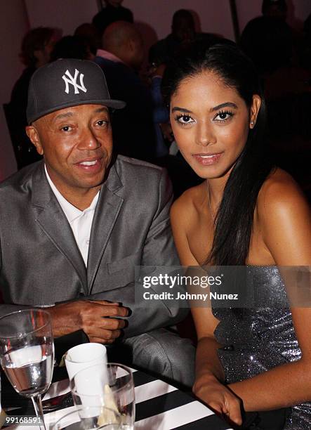 Russell Simmons and model Heidi Allende attend the 2010 SESAC New York Music Awards at the IAC Building on May 12, 2010 in New York City.