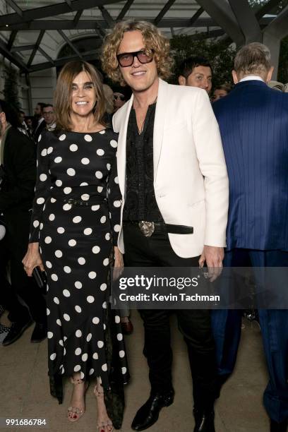 Carine Roitfeld and Peter Dundas attend the amfAR Paris Dinner at The Peninsula Hotel on July 4, 2018 in Paris, France.