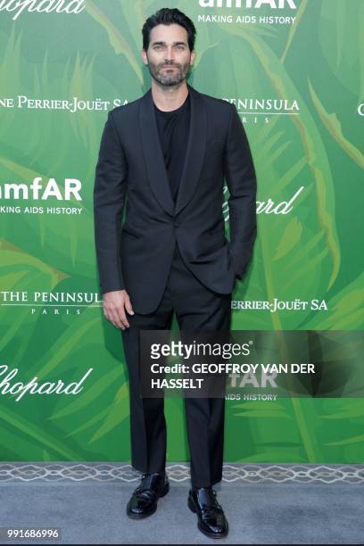 Actor Tyler Hoechlin poses during a photocall as he arrives for a dinner organized by the foundation for Aids research amfAR at The Peninsula in...