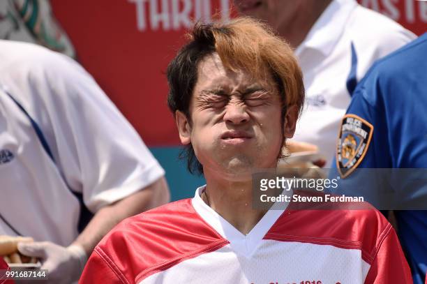 Max Suzuki competes in the Nathan's Hot Dog Eating Contest on July 4, 2018 in the Coney Island neighborhood of the Brooklyn borough of New York City.