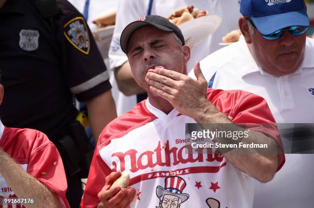 Contestants compete in the annual Nathan's Hot Dog Eating Contest on July 4, 2018 in the Coney Island neighborhood of the Brooklyn borough of New...