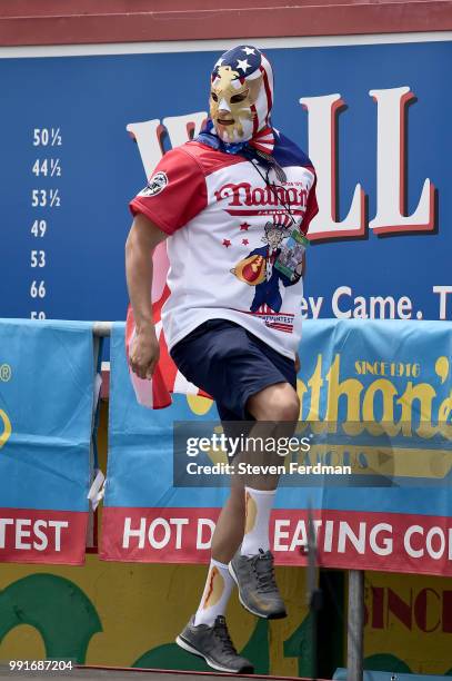 Contestants compete in the annual Nathan's Hot Dog Eating Contest on July 4, 2018 in the Coney Island neighborhood of the Brooklyn borough of New...