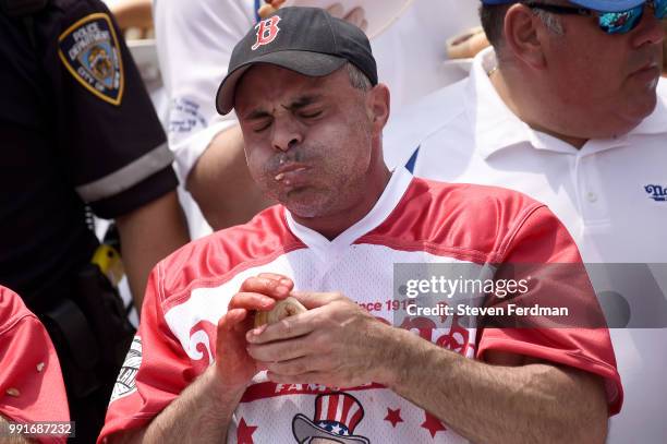 Contestants compete in the annual Nathan's Hot Dog Eating Contest on July 4, 2018 in the Coney Island neighborhood of the Brooklyn borough of New...