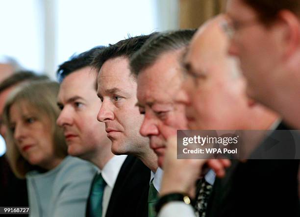 Deputy Prime Minister Nick Clegg looks on as Prime Minister David Cameron chairs his first cabinet meeting, at 10 Downing Street, on May 13, 2010 in...