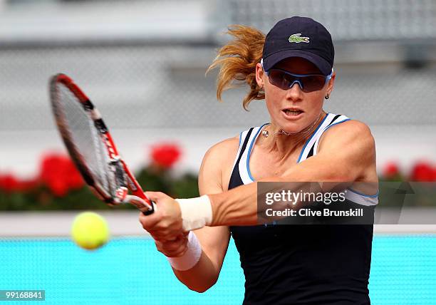 Samantha Stosur of Australia plays a backhand against Patty Schnyder of Switzerland in their third round match during the Mutua Madrilena Madrid Open...