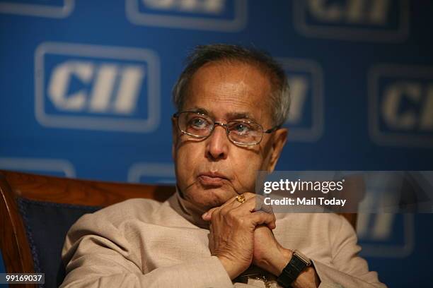 Union Finance Minister Pranab Mukherjee listens to a delegate at the CII National Conference and Annual Session 2010 in New Delhi on Wednesday, May...