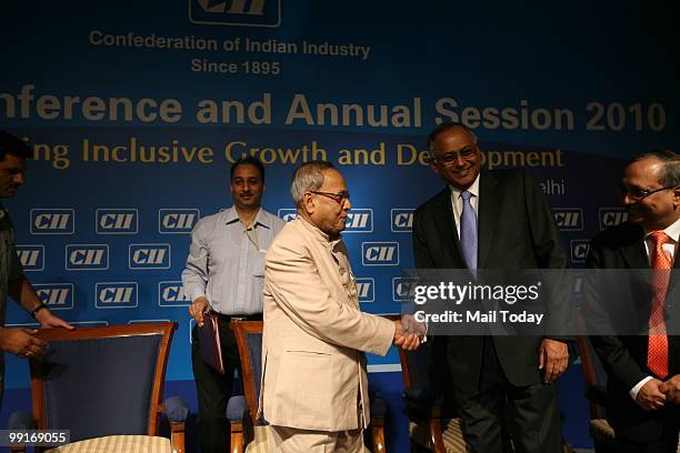 Union Finance Minister Pranab Mukherjee greets CII President Venu Srinivasan at the CII National Conference and Annual Session 2010 in New Delhi on...