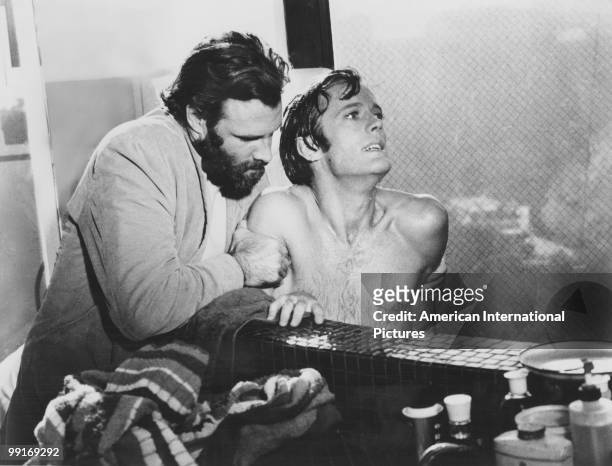 American actors Bruce Dern and Peter Fonda in a scene from 'The Trip', California, USA, 1966. The film was written by Jack Nicholson, directed by...