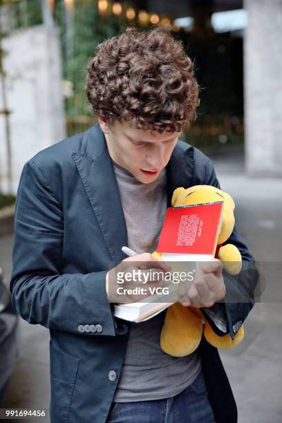 American actor Jesse Eisenberg signs his name for fans on June 30, 2018 in Shanghai, China.
