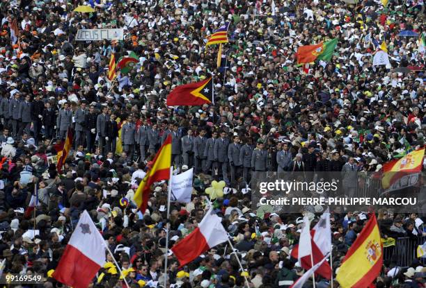 People attend an open-air mass led by Pope Benedict XVI at Fatima's Sanctuary on May 13, 2010. Pope Benedict XVI began a giant outdoor mass in the...