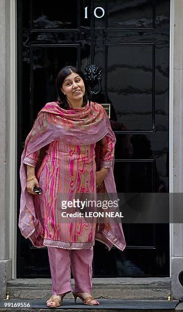 British Minister Without Portfolio, and Chairman of the Conservative Party, Baroness Warsi poses for pictures following a Cabinet meeting at 10...