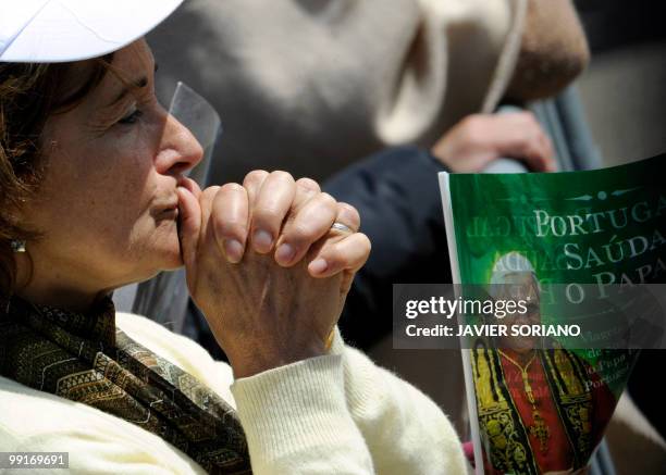 Pilgrim prays during a mass led by Pope Benedict XVI at Fatima's Sanctuary on May 13, 2010. Pope Benedict XVI began a giant outdoor mass in the...