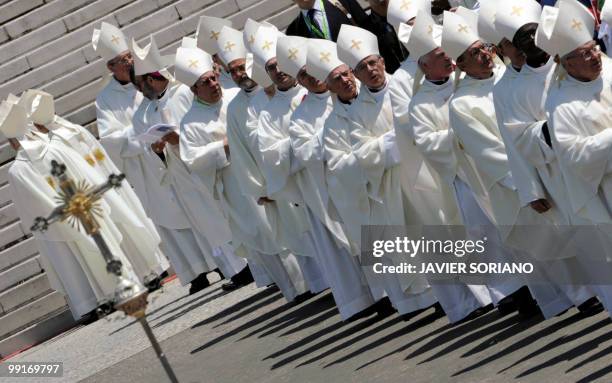 Priests stand during a mass celebrated by Pope Benedict XVI at the Fatima's Sanctuary, in Fatima, on May 13, 2010. Pope Benedict XVI began a giant...