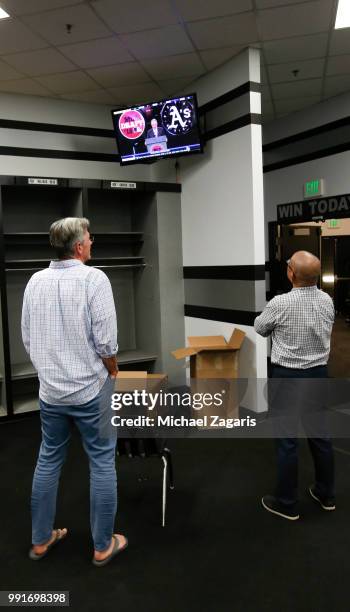 Executive Vice President of Baseball Operations Billy Beane and Director of Scouting Eric Kubota of the Oakland Athletics watch as the Athletics 1st...