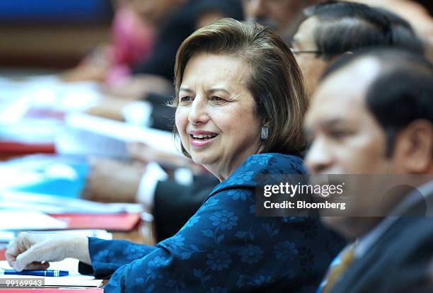 Zeti Akhtar Aziz, governor of Bank Negara Malaysia, center, pauses during a presentation of the first-quarter gross domestic product report at the...