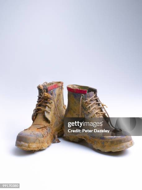 muddie walking boots - old shoes stockfoto's en -beelden