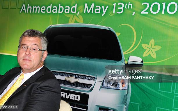 General Motors India President and Managing Director Karl Slym poses for photographers before the launch of a Compressed Natural Gas version of the...
