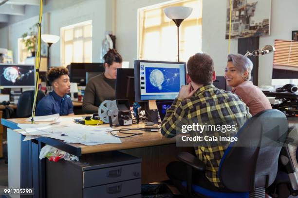 creative business people working at computers in open plan office - crowdsourcing stock-fotos und bilder