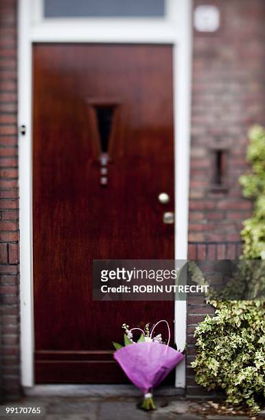 Picture taken on May 13, 2010 shows flowers that been brought in front of the house in Tilburg, southern Netherlands, of the family of 9-year old...