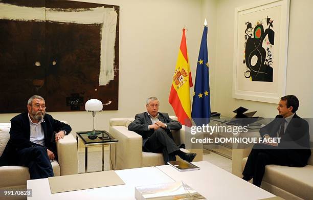Spain's Prime Minister Jose Luis Rodriguez Zapatero poses with Spanish trade unions leaders Fernandez Toxo and Candido Mendez before a meeting on May...