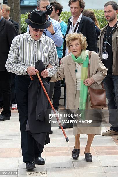 Portuguese director Manoel De Oliveira and his wife Maria Isabel Carvalhais pose during the photocall of the film "O Estranho Caso de Angelica"...