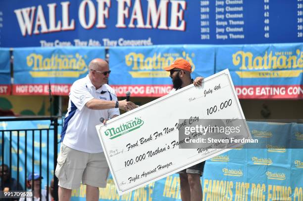 Nathan's donates 100,000 hot dogs to the New York City Food Back during Nathan's Hot Dog Eating Contest on July 4, 2018 in the Coney Island...