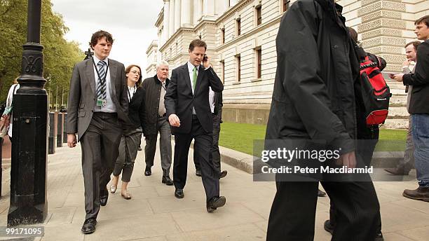 Deputy Prime Minister Nick Clegg talks on the telephone as he walks throught Westminster on May 13, 2010 in London, England. New Prime Minister David...