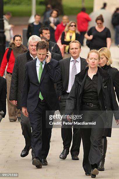 Deputy Prime Minister Nick Clegg talks on the telephone as he walks throught Westminster on May 13, 2010 in London, England. New Prime Minister David...