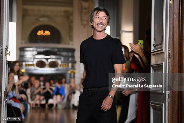 Pierpaolo Piccioli is appluaded on the runway during the Valentino Haute Couture Fall Winter 2018/2019 show as part of Paris Fashion Week on July 4,...