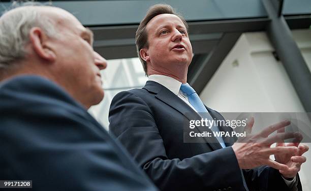 Britain's new Business Secretary, Vince Cable listens as new Conservative Prime Minister, David Cameron speaks during an official visit to the...