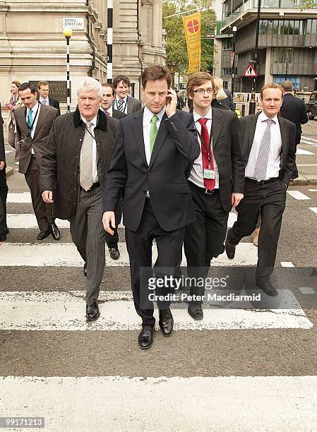 Deputy Prime Minister Nick Clegg talks on the telephone as he walks throught Westminster on May 13, 2010 in London, England. New Prime Minister David...